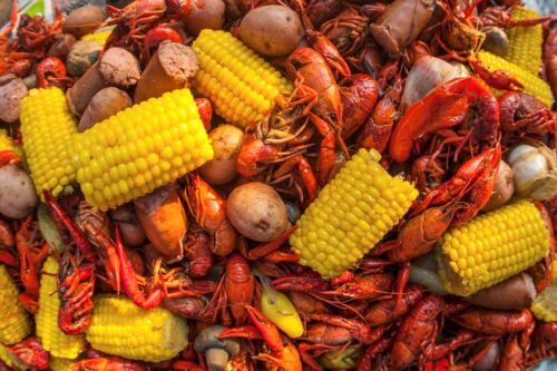 Boiled crawfish with sausage, corn and potatoes.